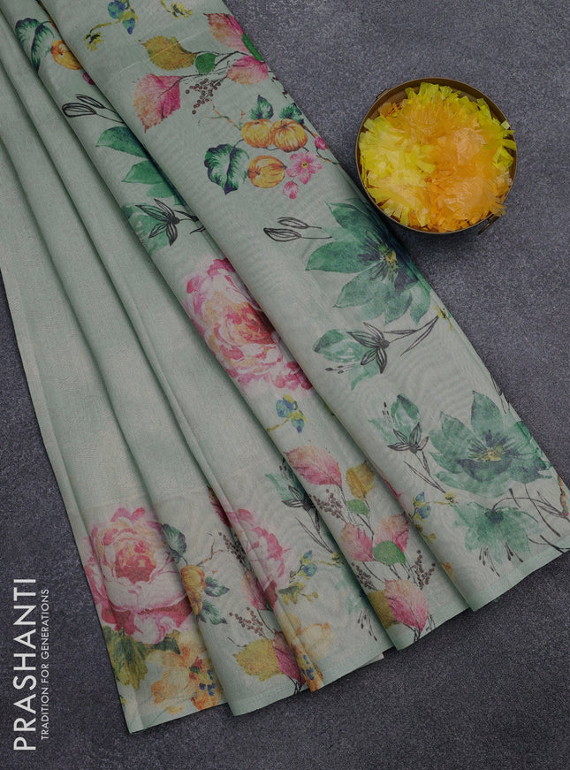 Tissue saree pastel green with allover zari weaves and digital printed border
