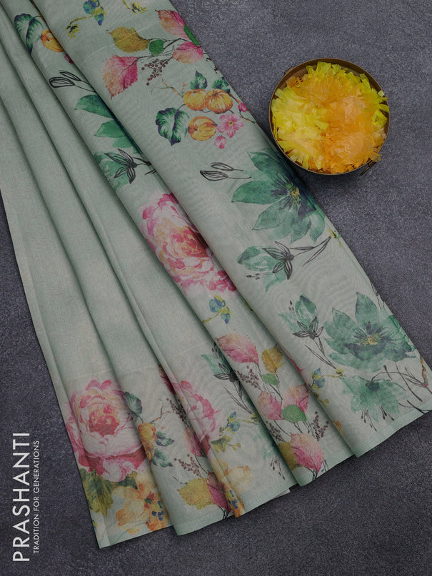 Tissue saree pastel green with allover zari weaves and digital printed border