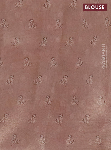 Tissue saree mild peach with allover zari weaves and digital printed border