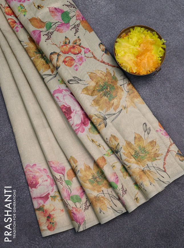 Tissue saree cream and pastel green with allover zari weaves and digital printed border