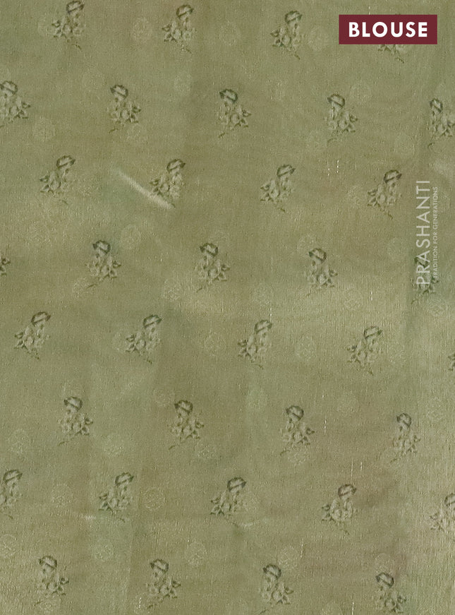 Tissue saree cream and pastel green with allover zari weaves and digital printed border