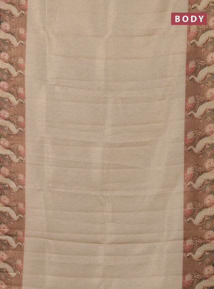 Tissue saree cream and peach shade with allover zari weaves and floral digital printed border