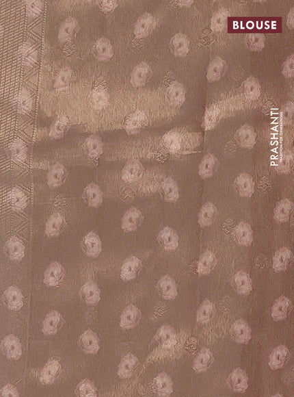 Tissue saree cream and peach shade with allover zari weaves and floral digital printed border