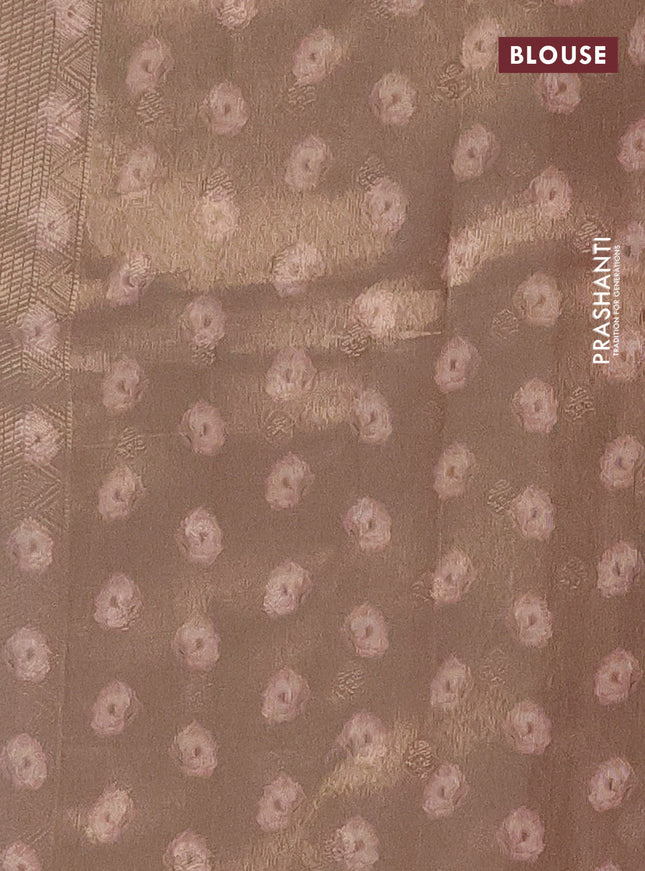Tissue saree cream and peach shade with allover zari weaves and floral digital printed border