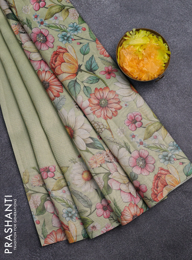 Tissue saree pista green with allover zari weaves and floral digital printed border