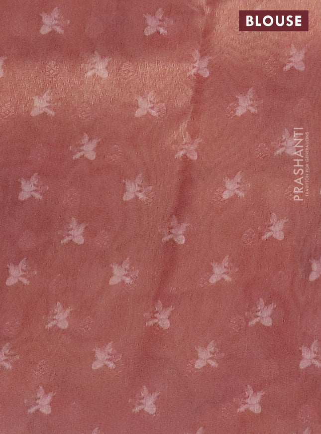 Tissue saree peach orange with allover zari weaves and floral digital printed border