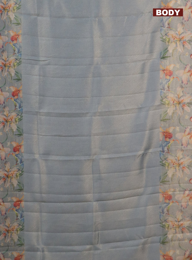 Tissue saree pastel blue with allover zari weaves and floral digital printed border