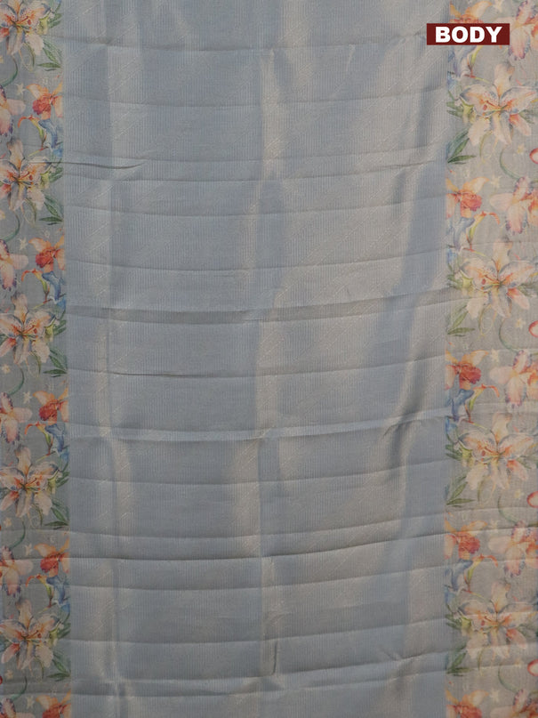 Tissue saree pastel blue with allover zari weaves and floral digital printed border
