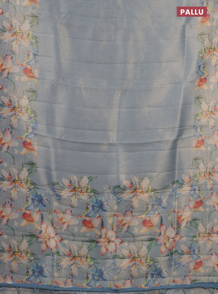 Tissue saree pastel blue with allover zari weaves and floral digital printed border