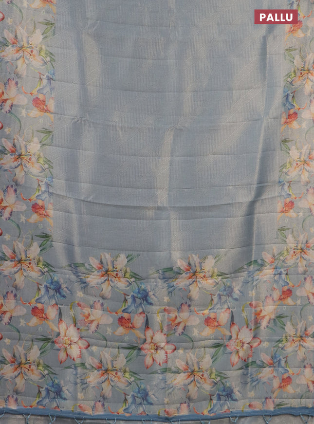 Tissue saree pastel blue with allover zari weaves and floral digital printed border