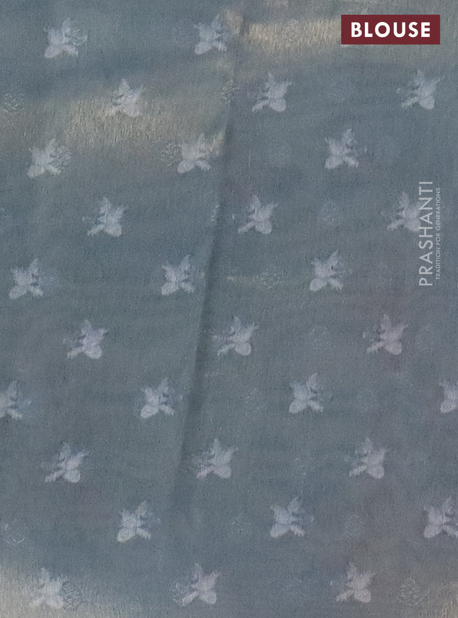 Tissue saree pastel blue with allover zari weaves and floral digital printed border