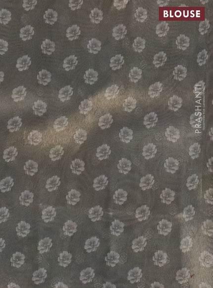 Tissue saree pastel grey with allover zari weaves and floral digital printed border