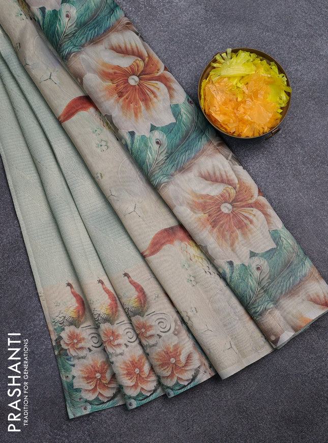 Tissue saree pastel green with allover zari weaves and floral digital printed border