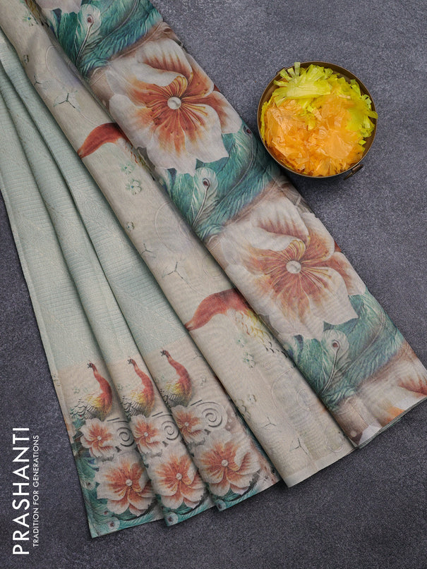 Tissue saree pastel green with allover zari weaves and floral digital printed border