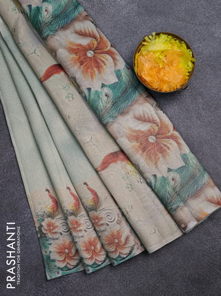 Tissue saree pastel green with allover zari weaves and floral digital printed border