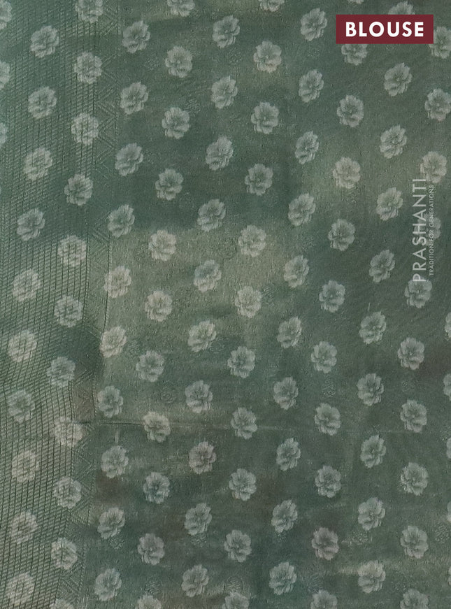 Tissue saree pastel green with allover zari weaves and floral digital printed border