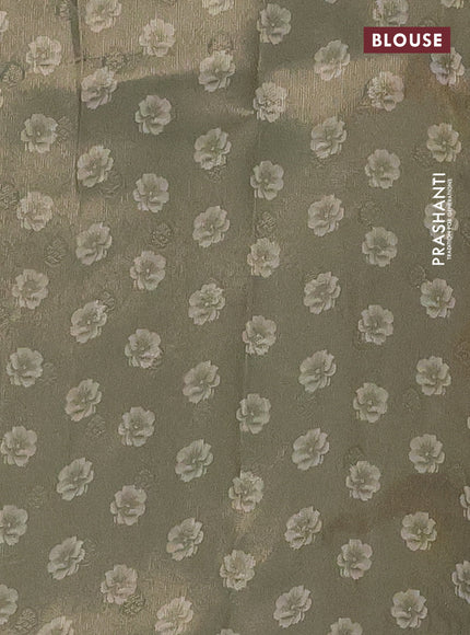 Tissue saree cream with allover zari weaves and floral digital printed border