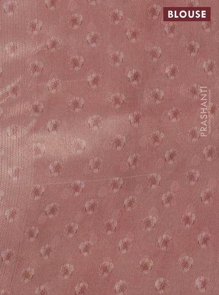 Tissue saree mild peach with allover zari weaves and floral digital printed border