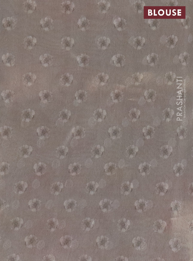 Tissue saree beige and pastel grey with allover zari weaves and floral digital printed border