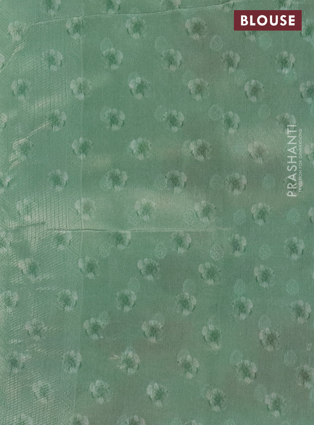 Tissue saree pista green with allover zari weaves and floral digital printed border