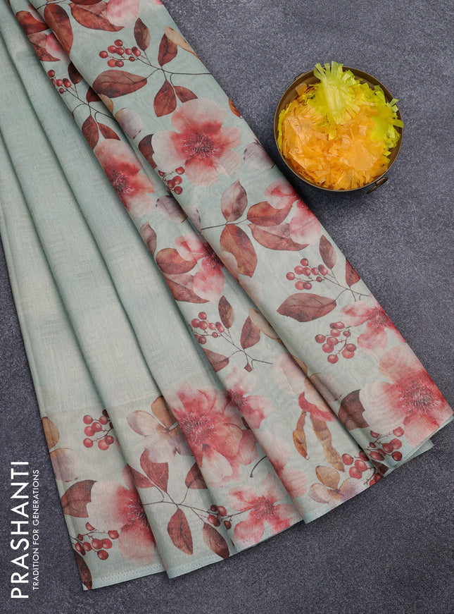 Tissue saree pastel green with allover zari weaves and floral digital printed border