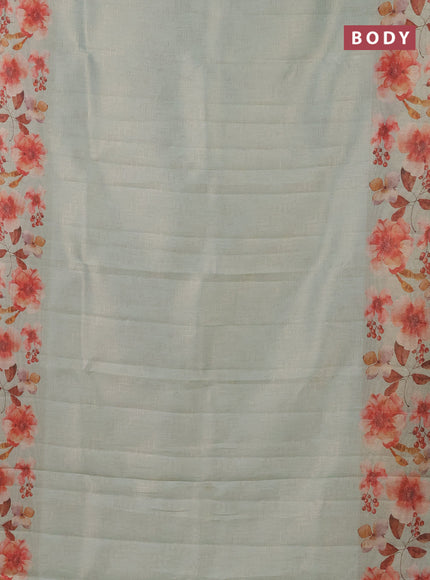 Tissue saree pastel green with allover zari weaves and floral digital printed border