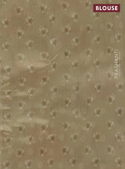 Tissue saree cream with allover zari weaves and floral digital printed border