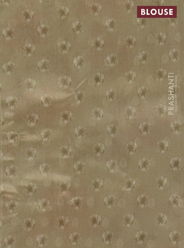 Tissue saree cream with allover zari weaves and floral digital printed border