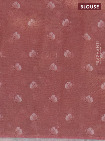 Tissue saree pastel peach with allover zari weaves and floral digital printed border