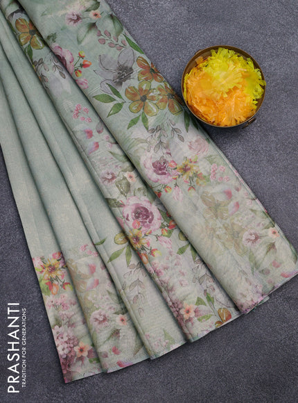 Tissue saree pastel green with allover zari weaves and floral digital printed border