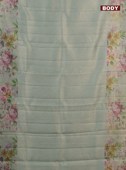 Tissue saree pastel green with allover zari weaves and floral digital printed border