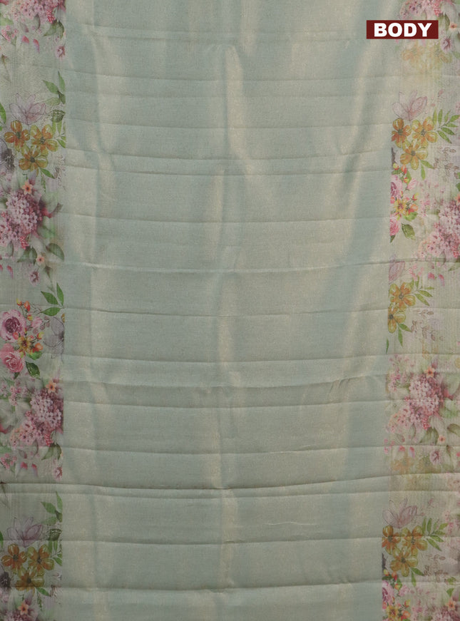 Tissue saree pastel green with allover zari weaves and floral digital printed border