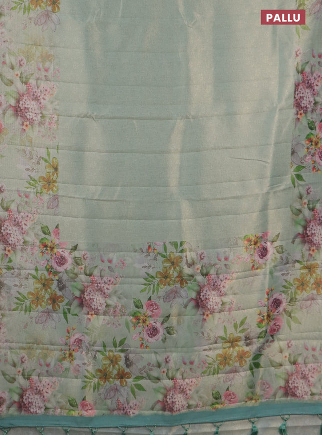 Tissue saree pastel green with allover zari weaves and floral digital printed border