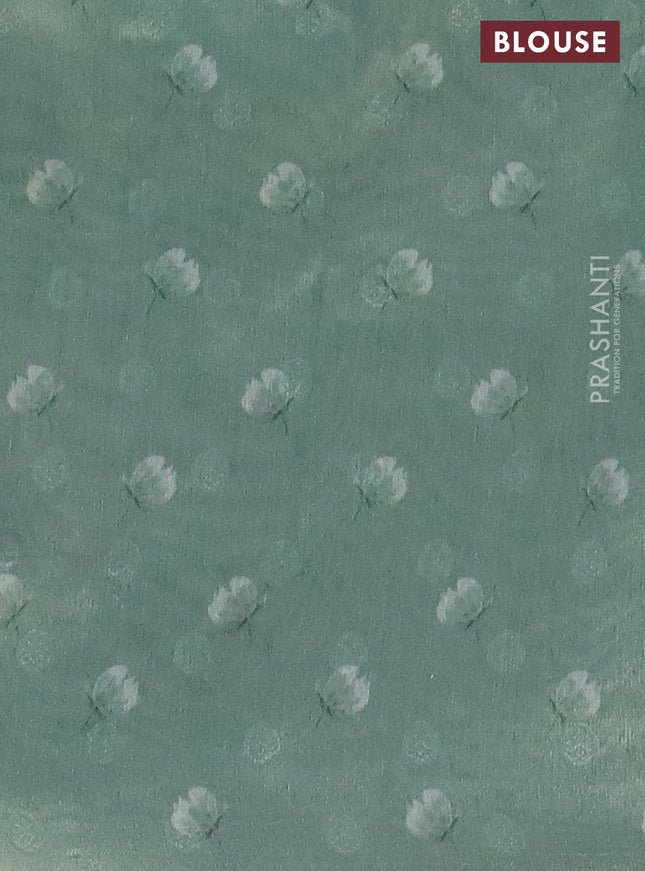 Tissue saree pastel green with allover zari weaves and floral digital printed border