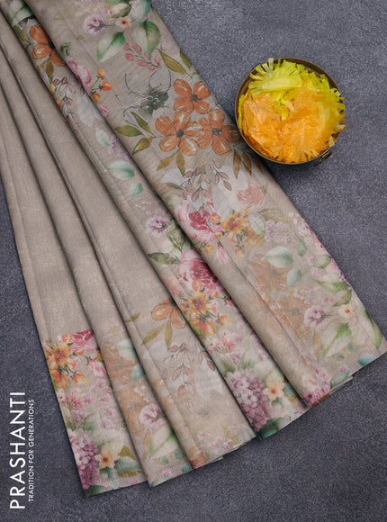 Tissue saree beige and green shade with allover zari weaves and floral digital printed border