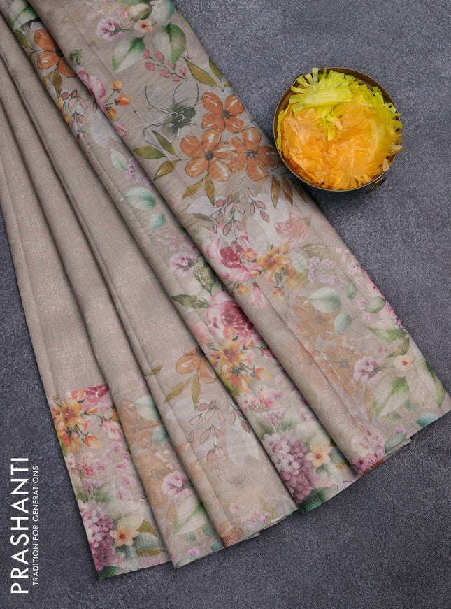 Tissue saree beige and green shade with allover zari weaves and floral digital printed border
