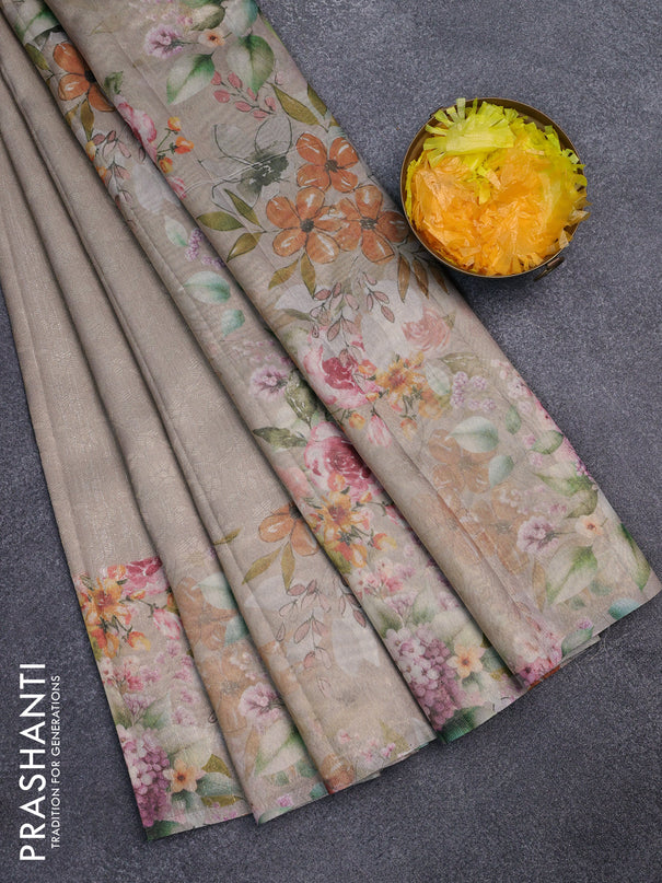Tissue saree beige and green shade with allover zari weaves and floral digital printed border