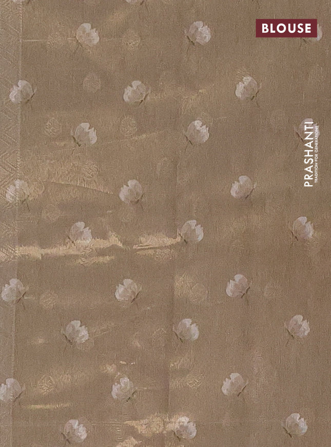 Tissue saree beige and green shade with allover zari weaves and floral digital printed border