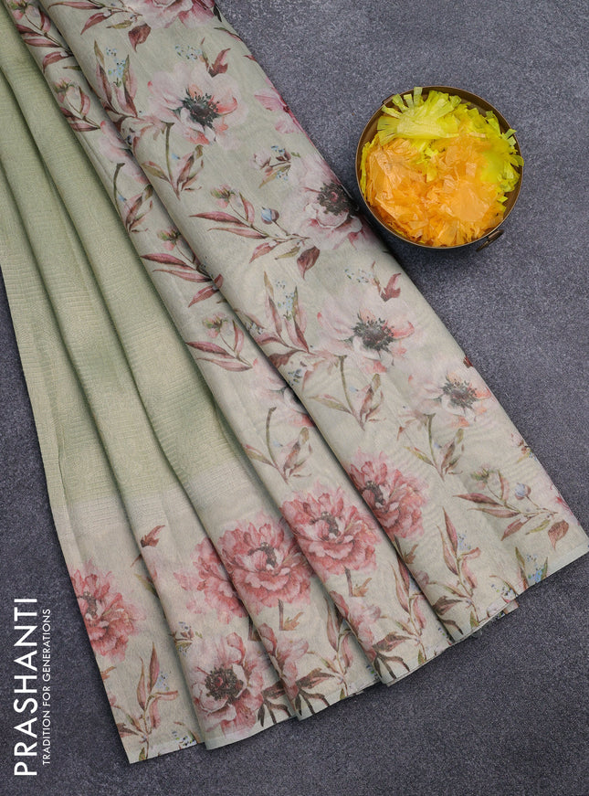 Tissue saree pista green with allover zari weaves and floral digital printed border