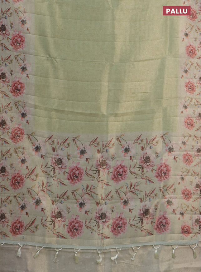 Tissue saree pista green with allover zari weaves and floral digital printed border