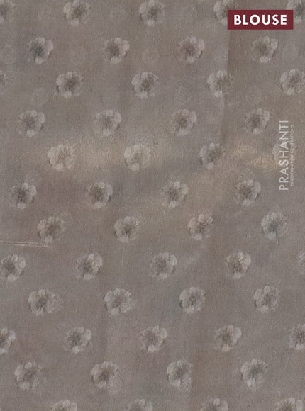 Tissue saree beige with allover zari weaves and floral digital printed border