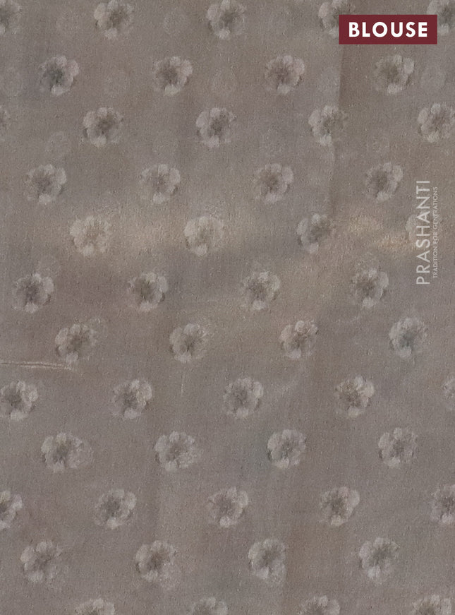 Tissue saree beige with allover zari weaves and floral digital printed border