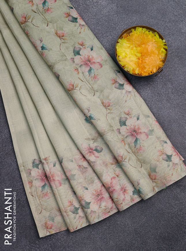 Tissue saree pista green with allover zari weaves and floral digital printed border