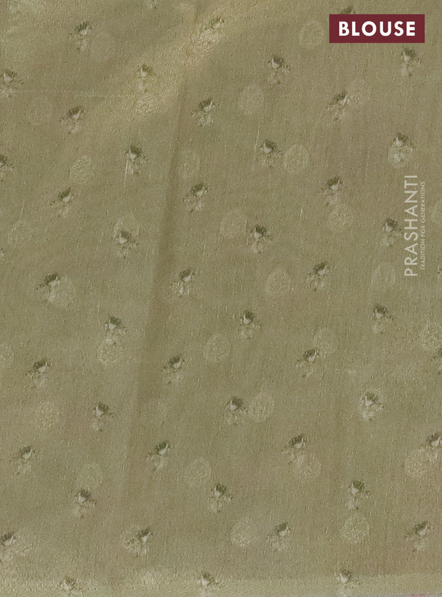 Tissue saree mild peach and pista green with allover zari weaves and floral digital printed border