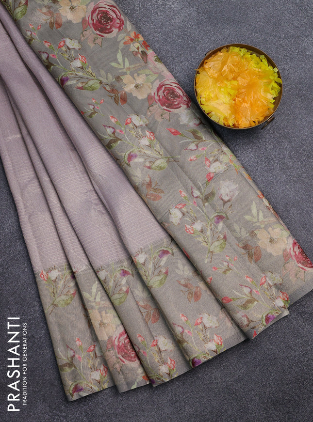 Tissue saree mild lavender and grey with allover zari weaves and floral digital printed border
