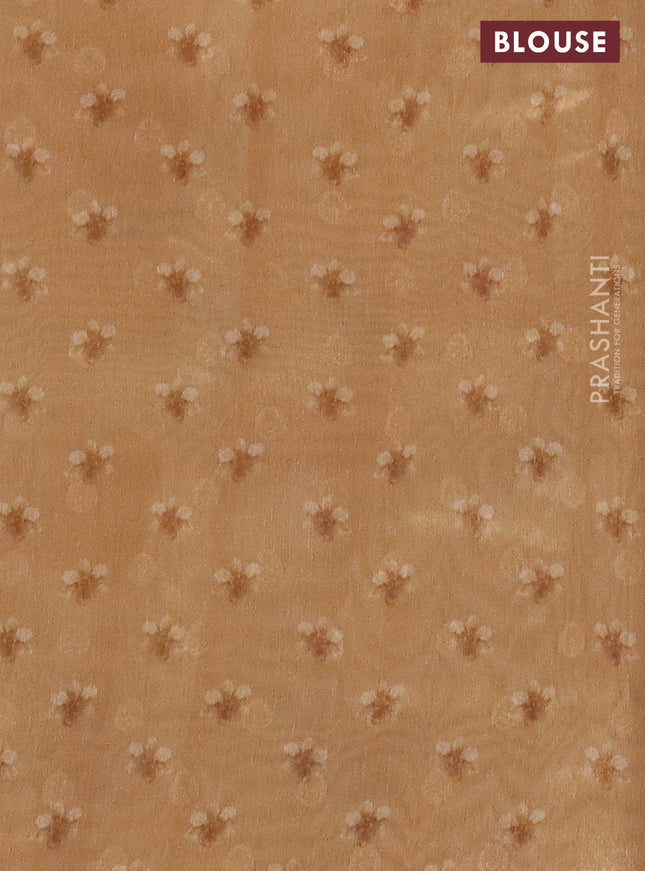 Tissue saree sandal and pale orange with allover zari weaves and floral digital printed border