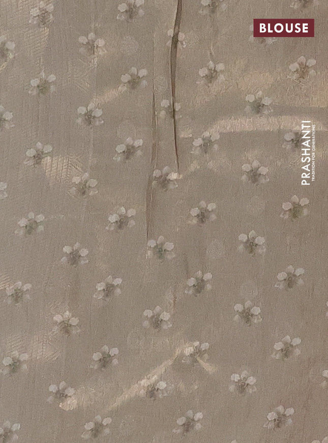 Tissue saree beige with allover zari weaves and floral digital printed border