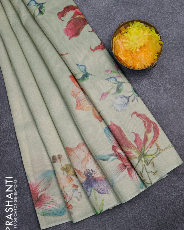Tissue saree pista green with allover zari weaves and floral digital printed border