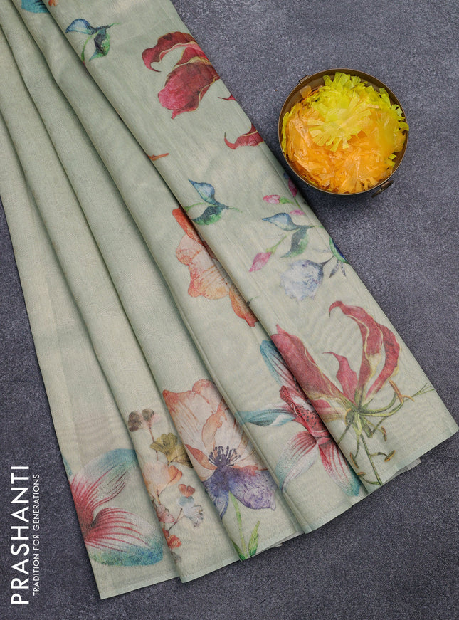 Tissue saree pista green with allover zari weaves and floral digital printed border