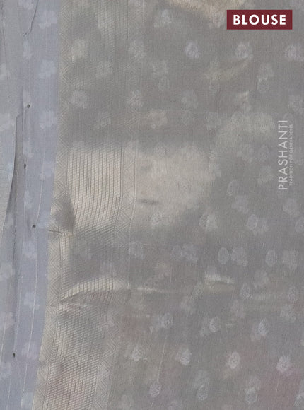 Tissue saree grey shade with allover zari weaves and floral digital printed border